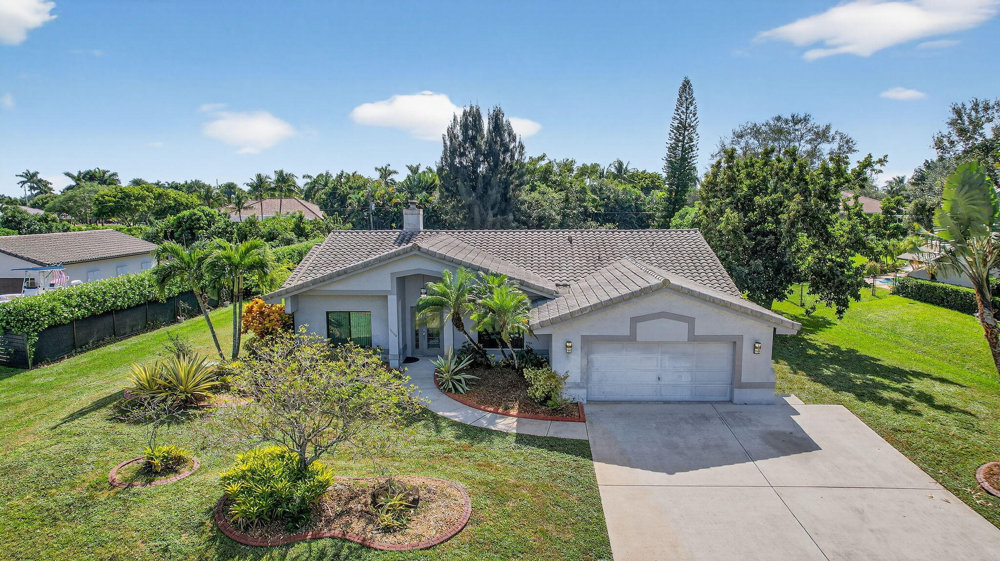 13150 Southwest 16th Court Davie, FL 33325 - Photo 50 of 59 a aerial view of a house with a yard and potted plants