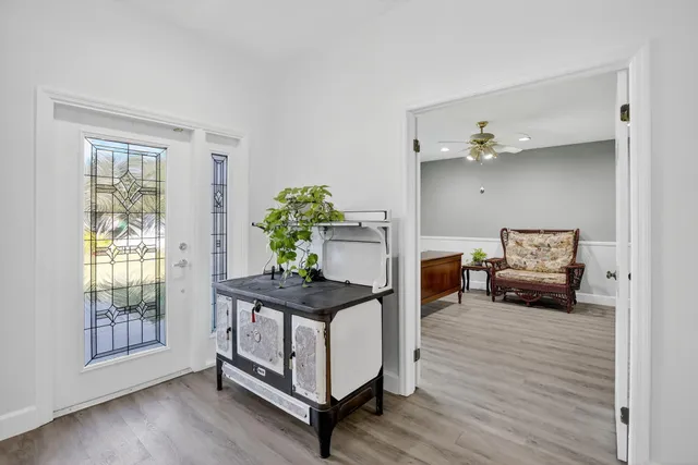 a view of a dining room with furniture and wooden floor