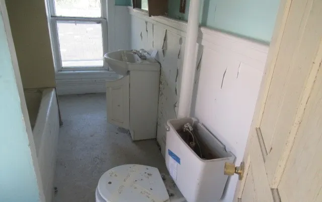 a bathroom with a sink and toilet