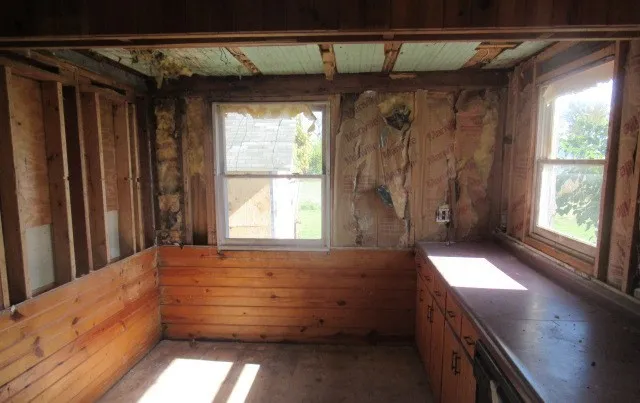 a view of entry way with wooden floor and windows