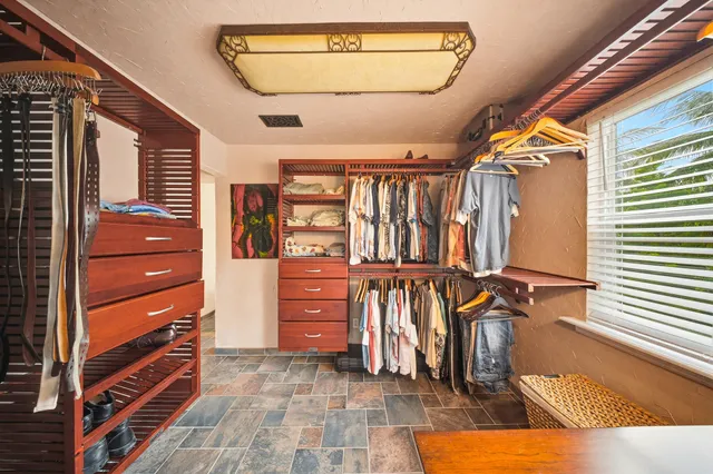a bathroom with a toilet a sink and shower