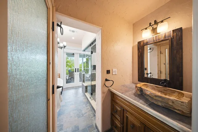 a view of a room with wooden floor and furniture