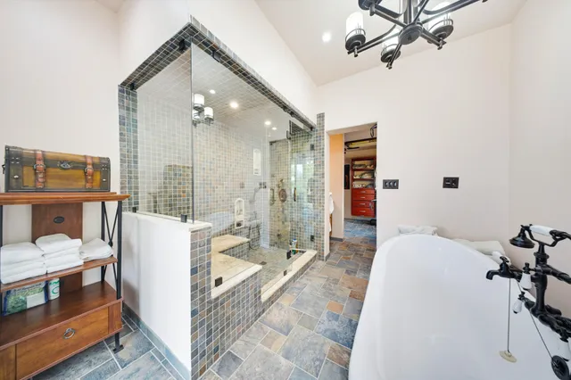 a view of a balcony with floor to ceiling windows wooden floor and outdoor view