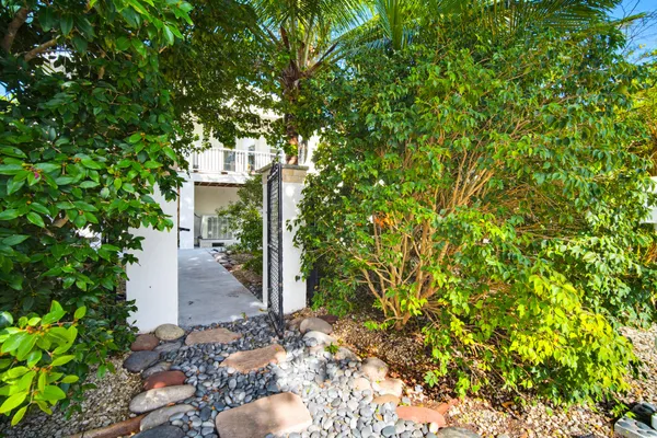 a view of a house with a tree
