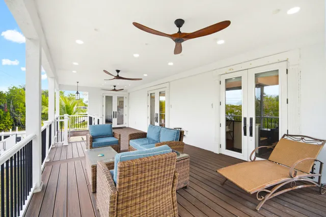 an aerial view of a house with a yard and potted plants
