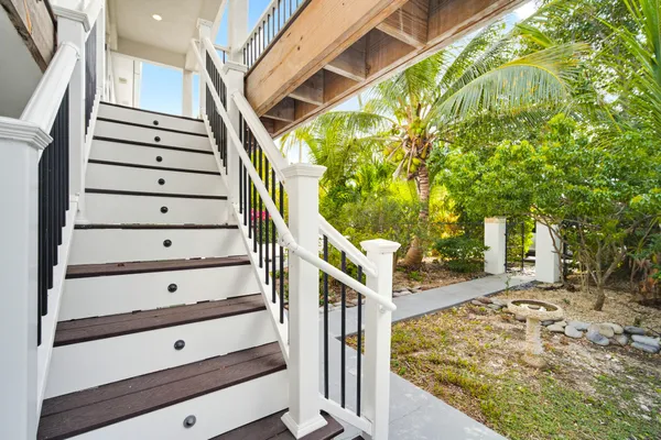 a view of staircase with wooden floor and fence