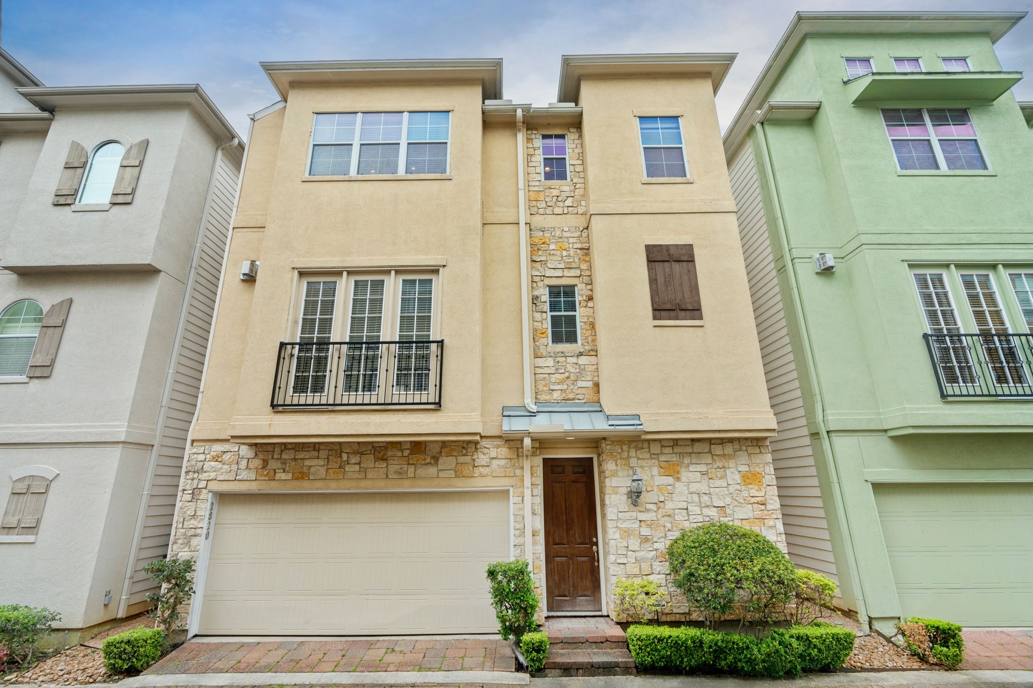 a front view of a house with many windows