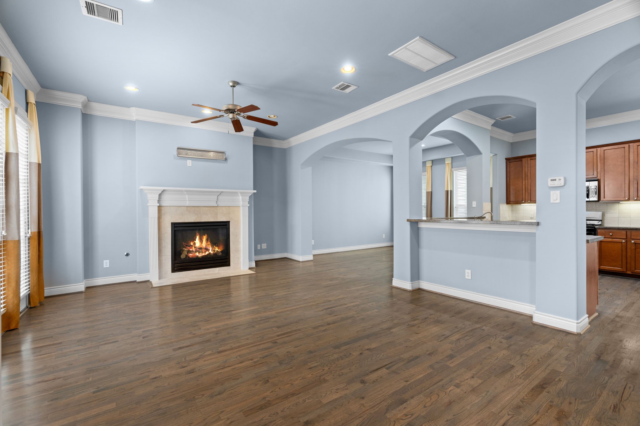 2820 Sherwin Street Houston, TX 77007 - Photo 13 of 50 a view of a kitchen with a sink and a fireplace