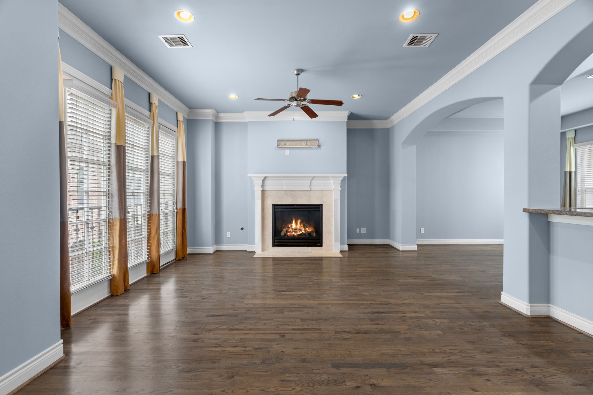 2820 Sherwin Street Houston, TX 77007 - Photo 15 of 50 a view of an empty room with a fireplace and a window