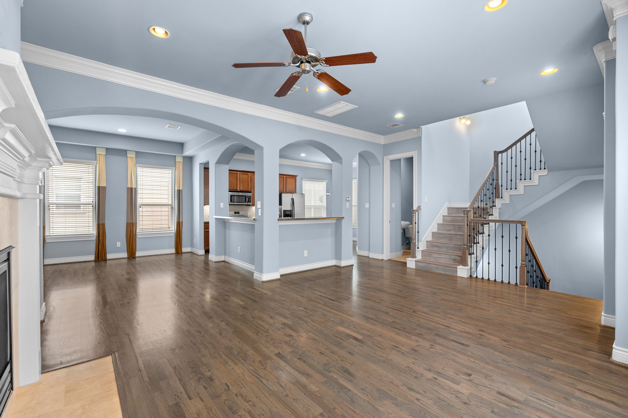 2820 Sherwin Street Houston, TX 77007 - Photo 18 of 50 a view of an entryway with wooden floor and a ceiling fan