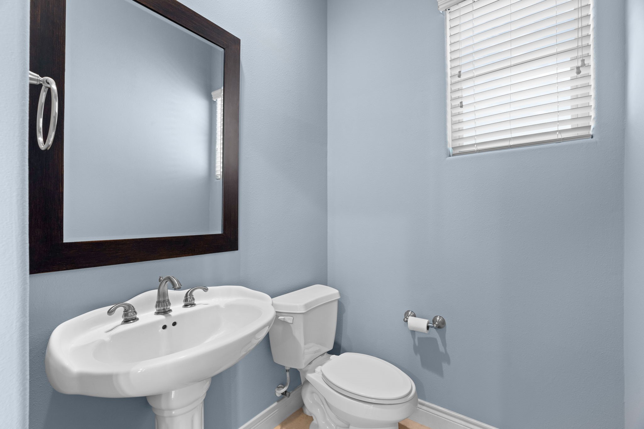 2820 Sherwin Street Houston, TX 77007 - Photo 19 of 50 a bathroom with a sink mirror and toilet