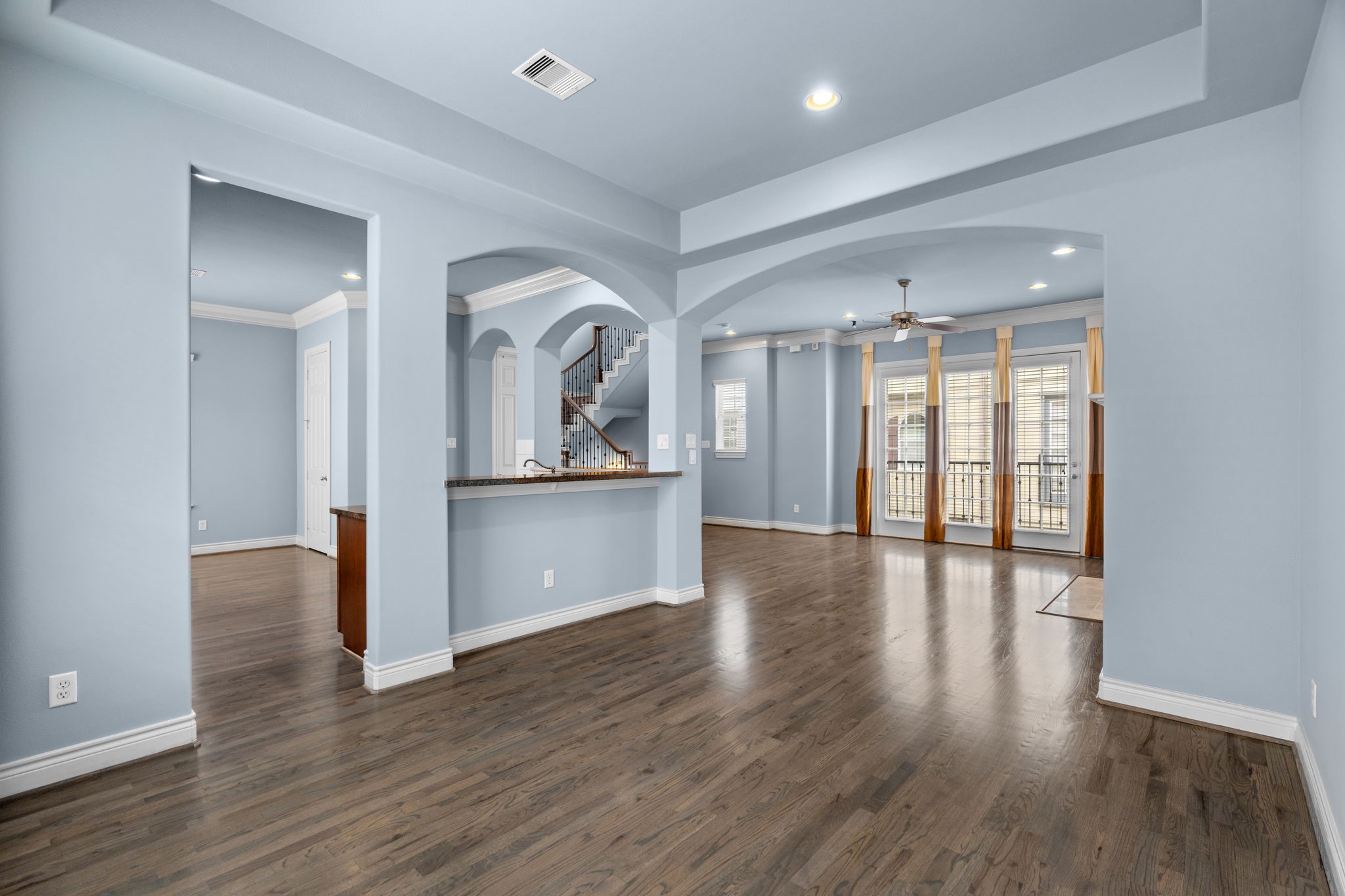 2820 Sherwin Street Houston, TX 77007 - Photo 23 of 50 a view of a room with wooden floor and a kitchen