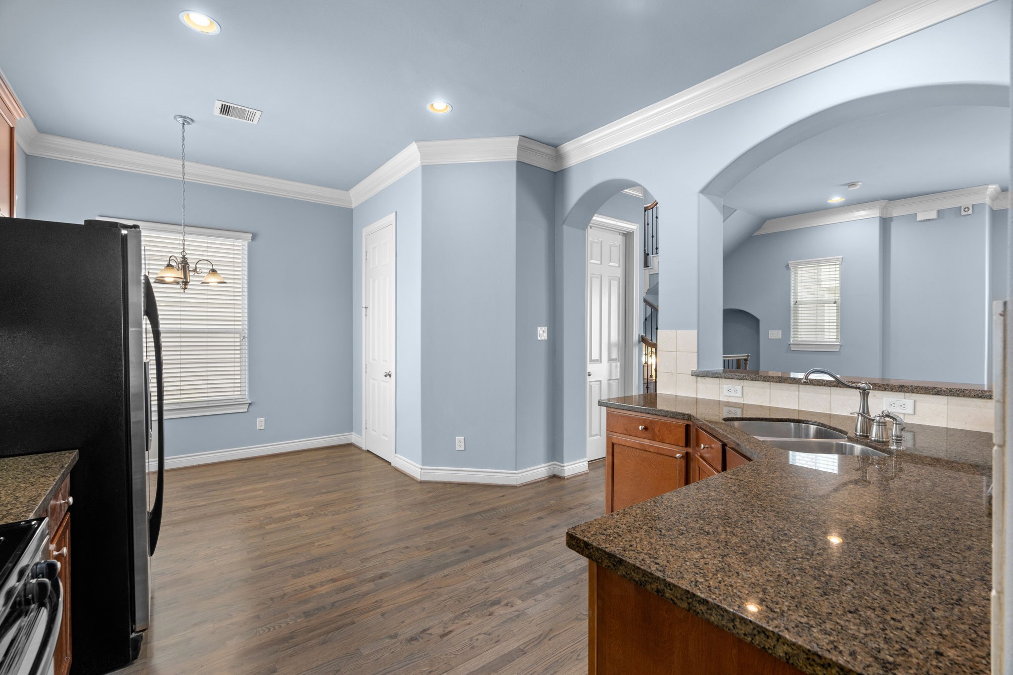 2820 Sherwin Street Houston, TX 77007 - Photo 26 of 50 a kitchen with stainless steel appliances granite countertop a sink and a refrigerator