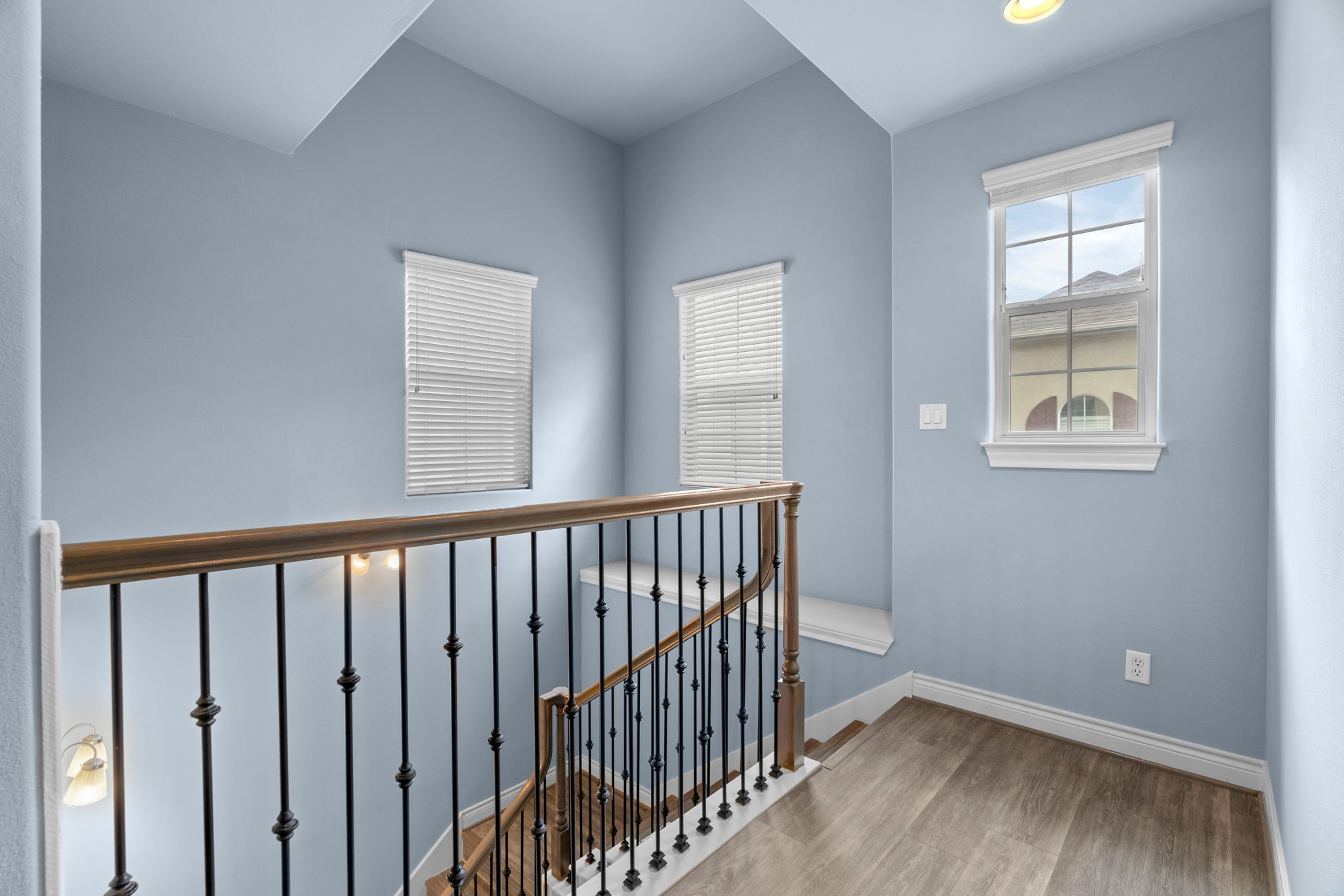 2820 Sherwin Street Houston, TX 77007 - Photo 32 of 50 a view of hallway with wooden floor and stairs