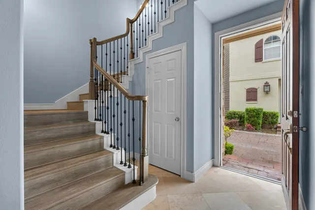 a view of entryway with wooden floor and door