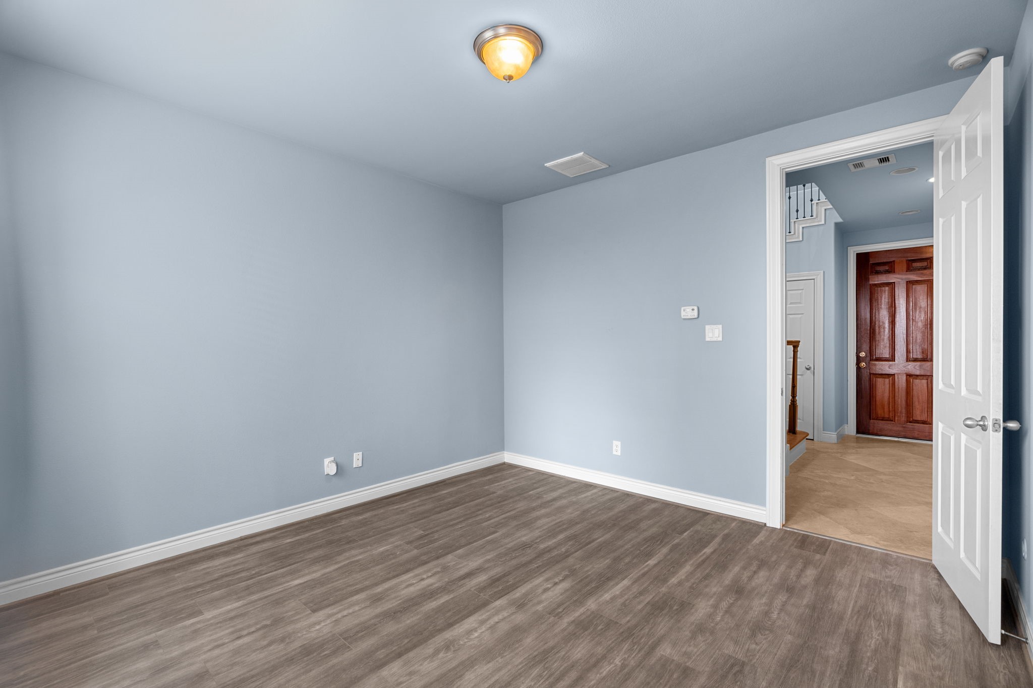 2820 Sherwin Street Houston, TX 77007 - Photo 9 of 50 wooden floor in an empty room with a window