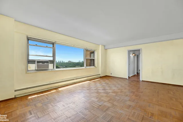 a view of an empty room with a window