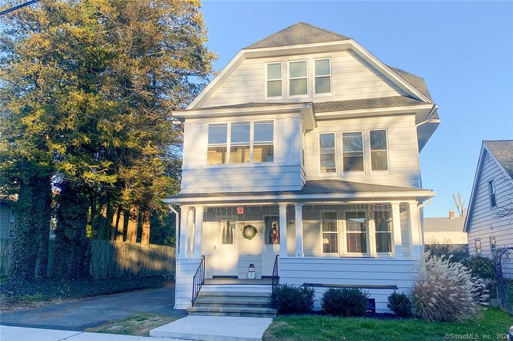48 Newton Street, Unit 3 Bridgeport, CT 06605 - Photo 1 of 1 a front view of a house with garden
