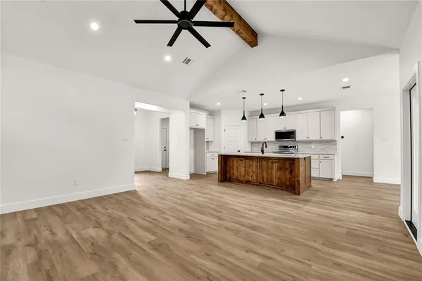 a view of kitchen with wooden floor and window