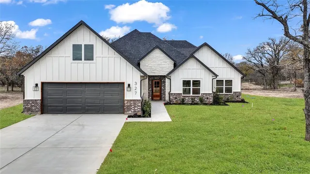 a front view of a house with yard