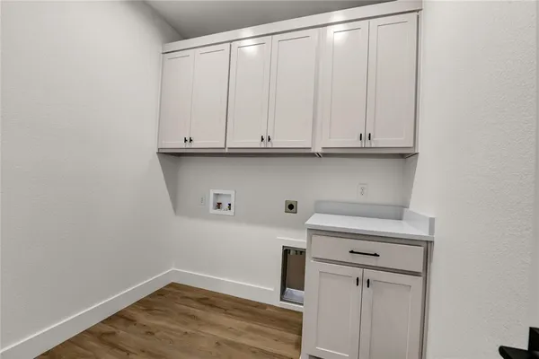 a view of cabinets with wooden floor