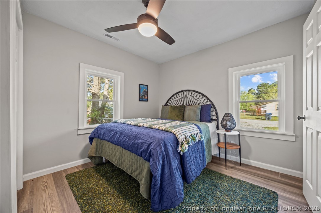 625 Eva Circle Spring Lake, NC 28390 - Photo 3 of 28 a bedroom with a bed and a window