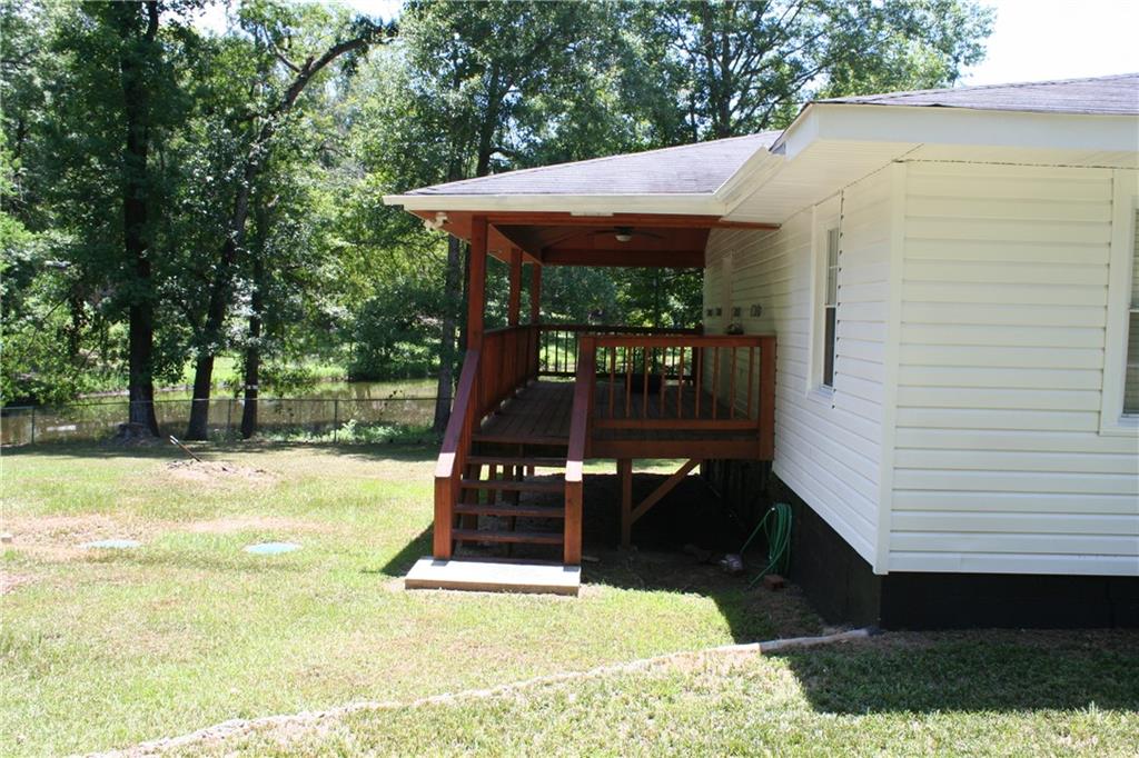 3735 South Seale Road Phenix City, AL 36869 - Photo 7 of 27 Rear Left Side with Large Covered Deck with ceiling fan and steps