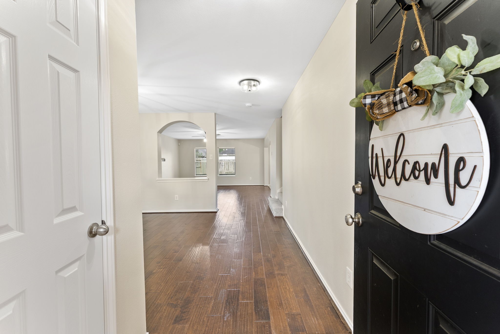 2419 Colonial Springs Lane Spring, TX 77386 - Photo 2 of 35 As you enter there is a coat closet on the left. Notice the rich wood floors, neutral paint colors and updated lighting.
