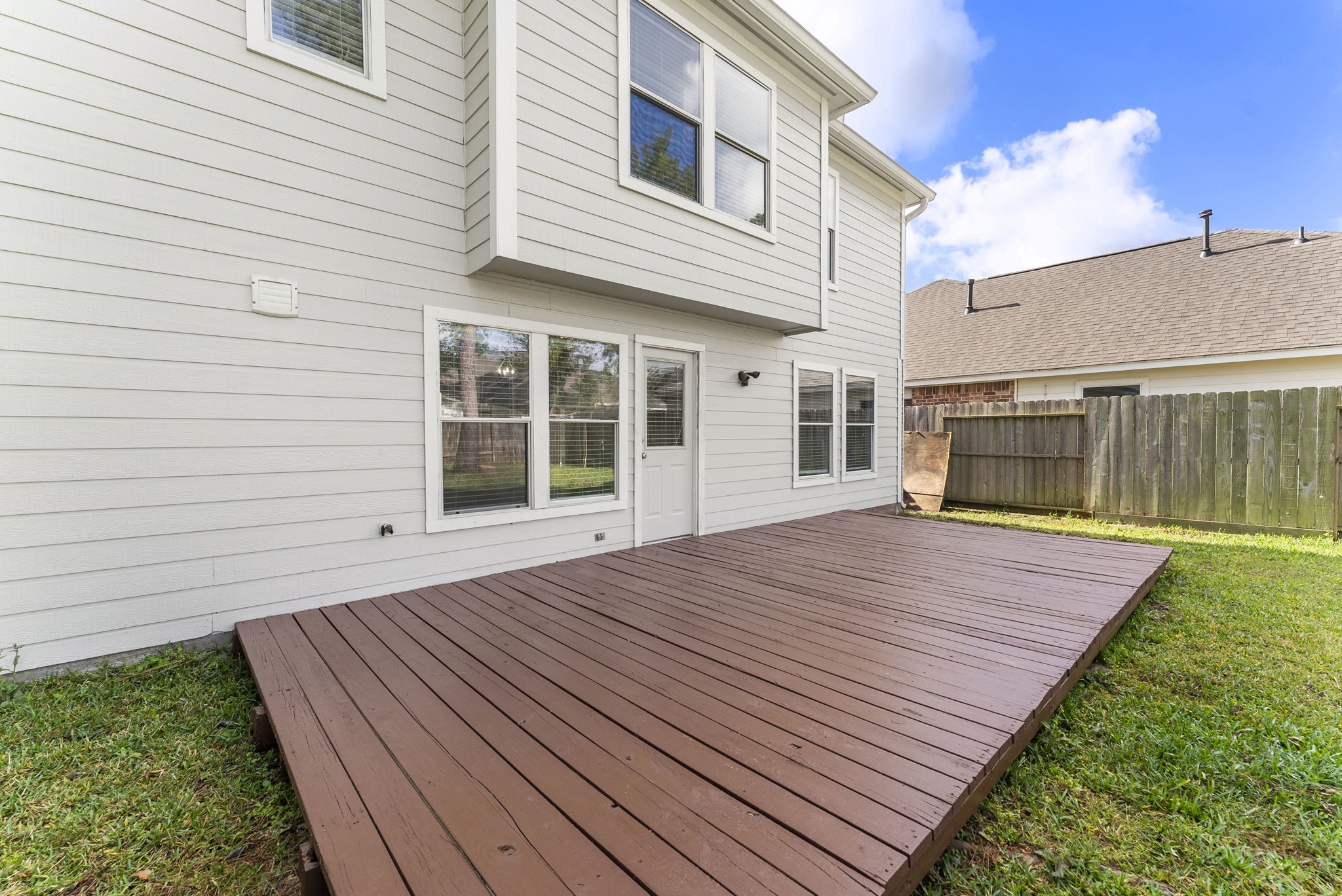 2419 Colonial Springs Lane Spring, TX 77386 - Photo 31 of 35 Large backyard space with deck for entertaining.