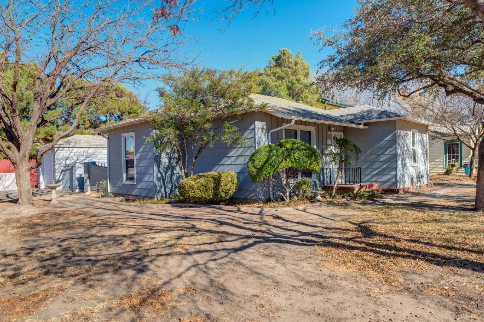 a front view of a house with garden