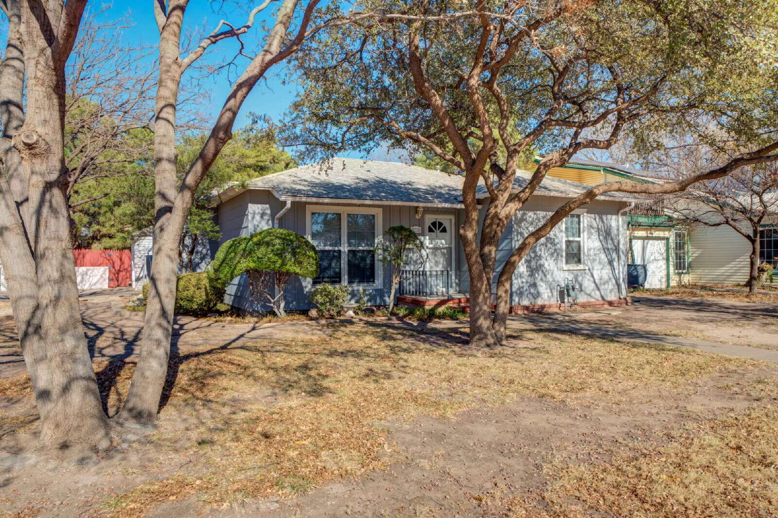 2710 27th Street Lubbock, TX 79410 - Photo 2 of 38 a view of a house with a tree in the background