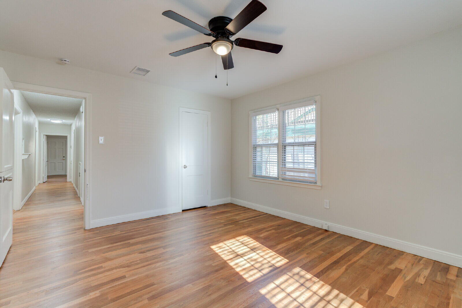 2710 27th Street Lubbock, TX 79410 - Photo 22 of 38 wooden floor in an empty room with a window