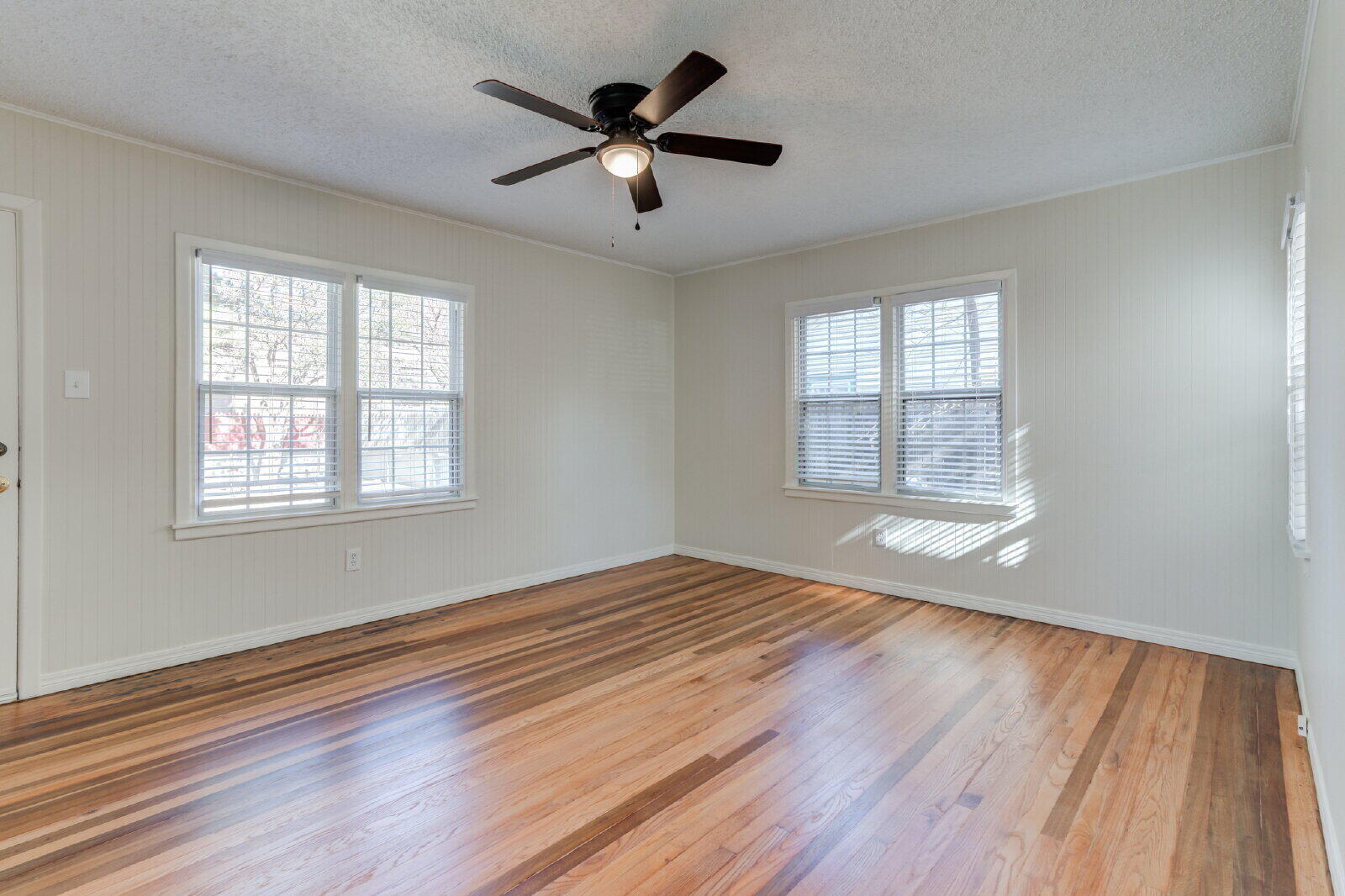 2710 27th Street Lubbock, TX 79410 - Photo 28 of 38 a view of empty room with wooden floor and fan