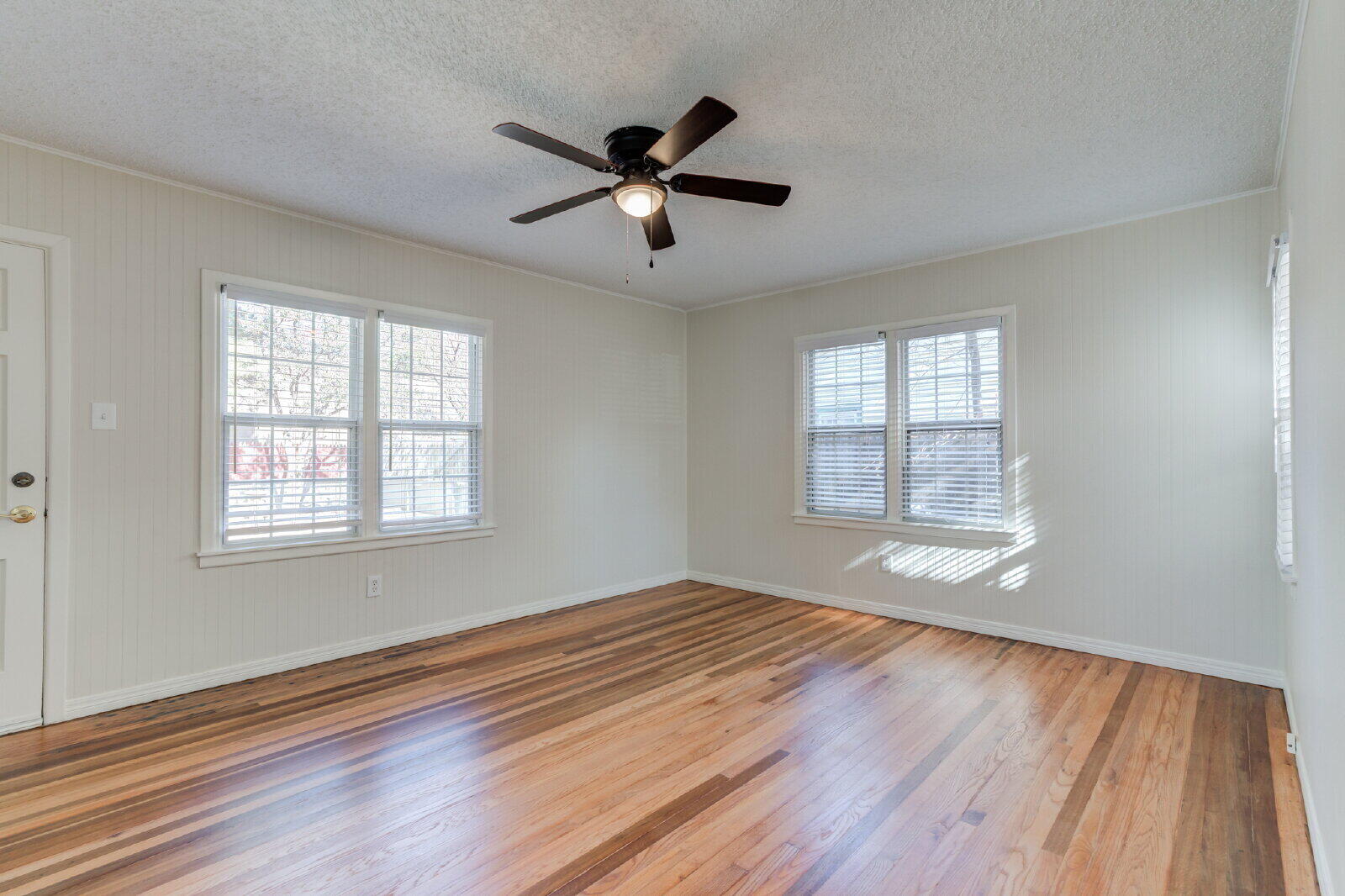 2710 27th Street Lubbock, TX 79410 - Photo 29 of 38 a view of empty room with wooden floor and fan
