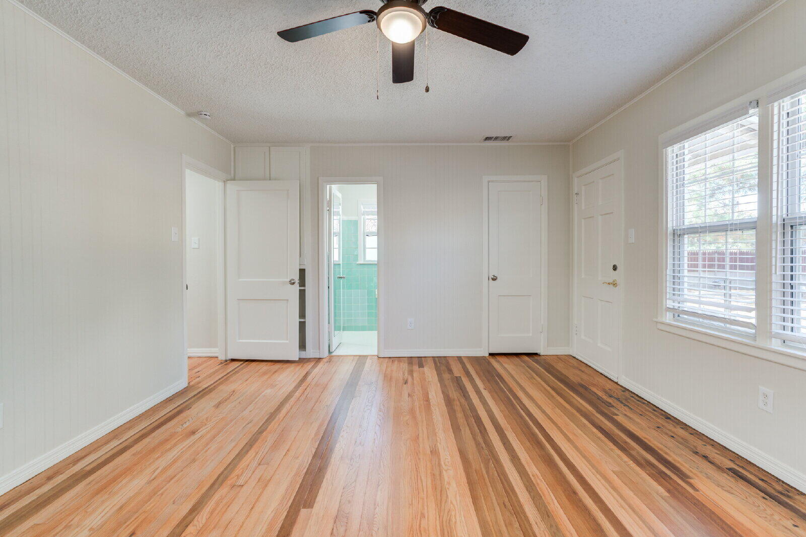 2710 27th Street Lubbock, TX 79410 - Photo 31 of 38 a view of empty room with wooden floor and fan
