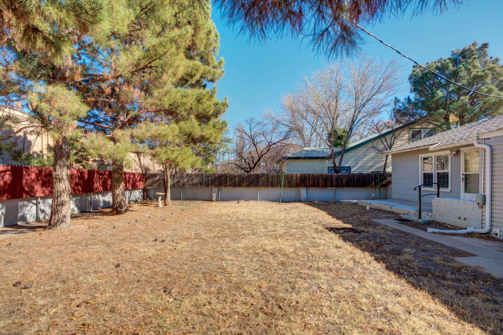 2710 27th Street Lubbock, TX 79410 - Photo 35 of 38 a view of a backyard with a tree