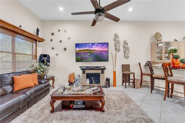 a living room with furniture and a fireplace