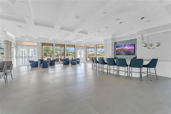 a view of a living room and livingroom with furniture wooden floor and windows