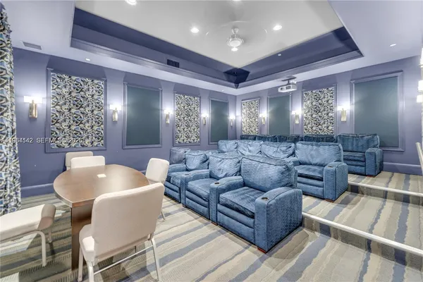 a living room with furniture and a large mirror