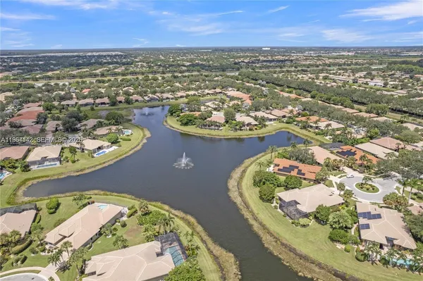 an aerial view of a house with a ocean view