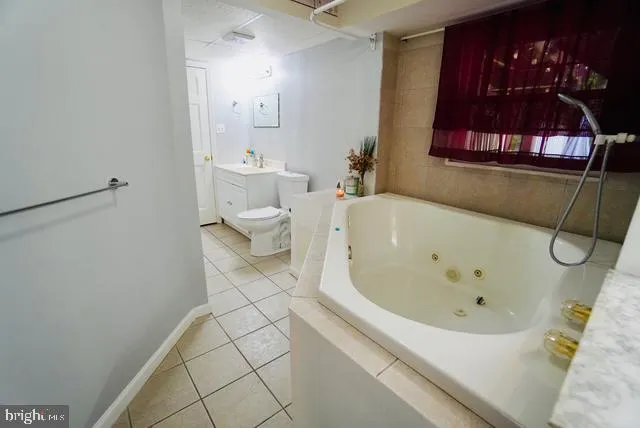 a bathroom with a bathtub and a toilet