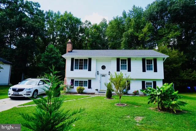 a front view of a house with a garden and porch