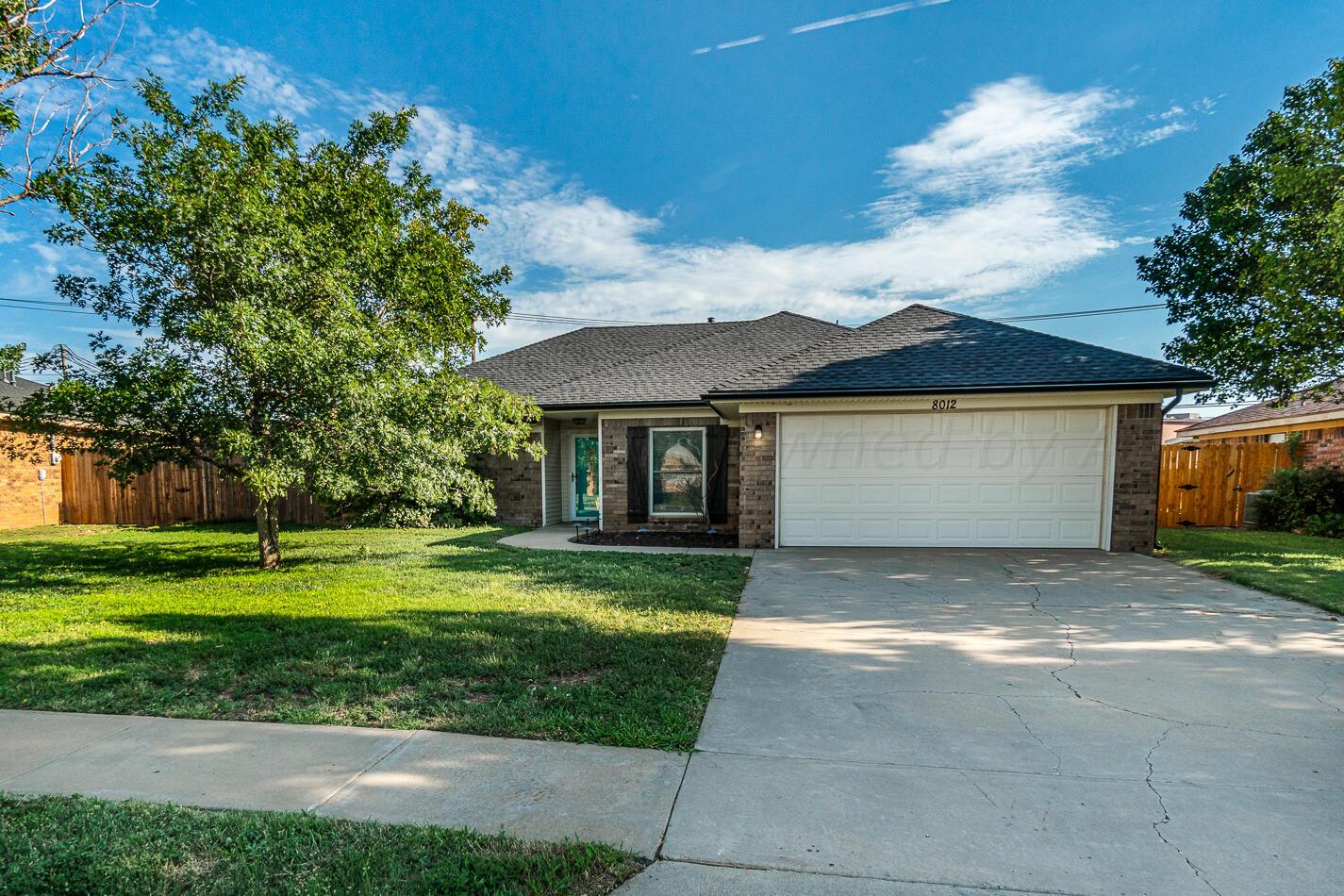 8012 Simpson Drive Amarillo, TX 79121 - Photo 1 of 28 a view of a house with a yard and tree s