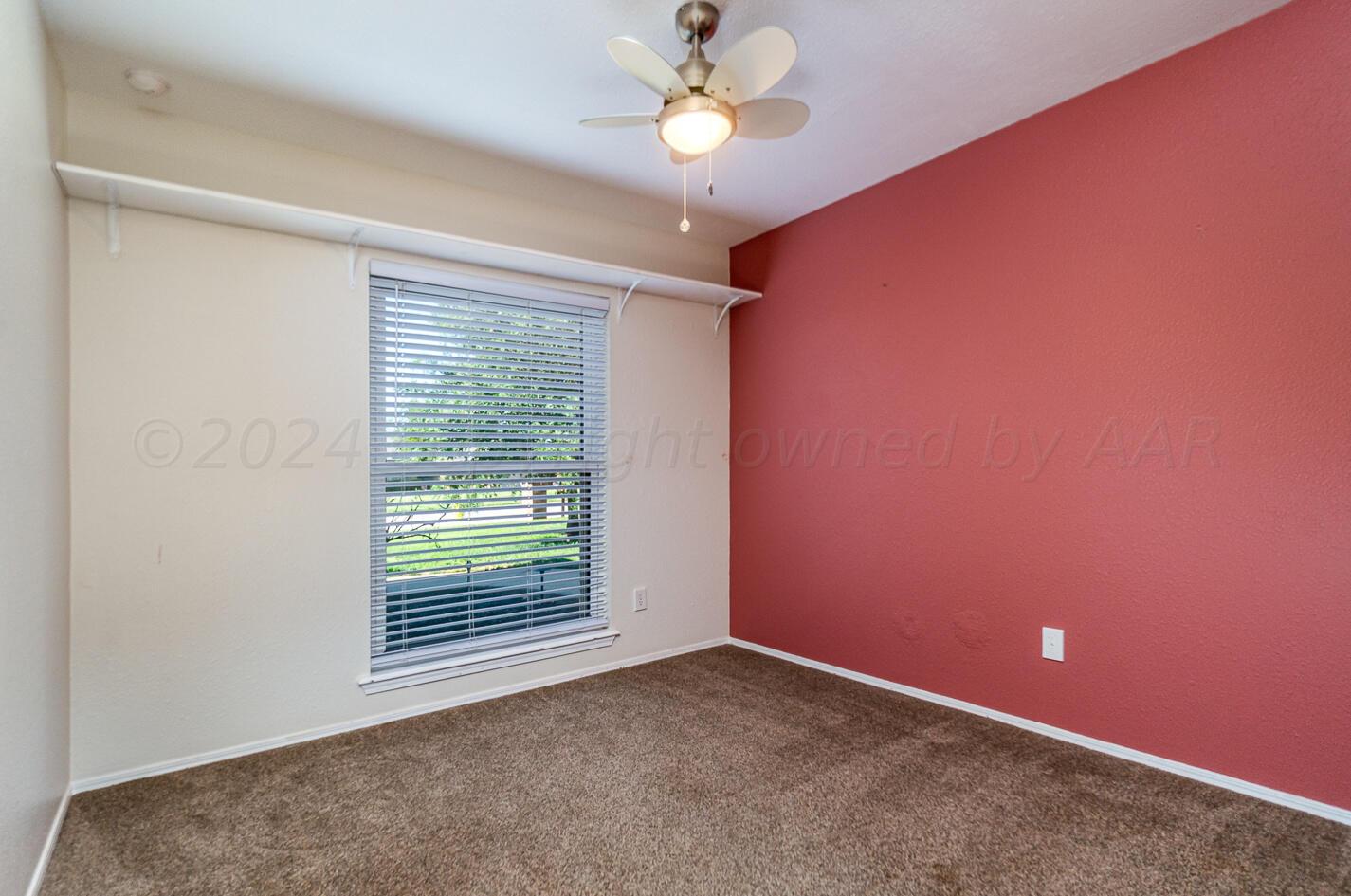 8012 Simpson Drive Amarillo, TX 79121 - Photo 20 of 28 a view of an empty room with a window