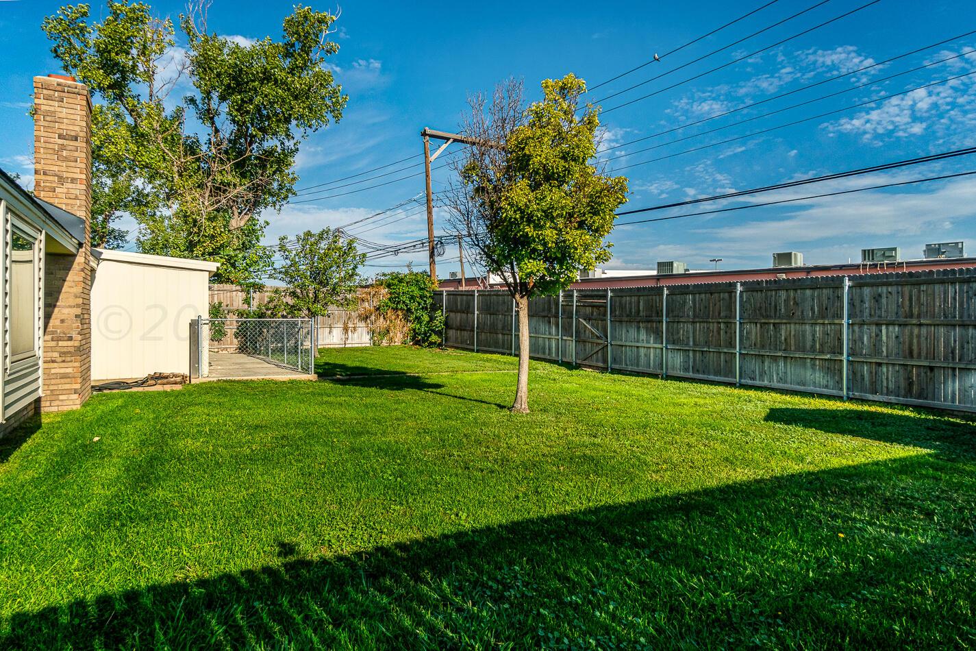 8012 Simpson Drive Amarillo, TX 79121 - Photo 25 of 28 a view of a backyard with a garden
