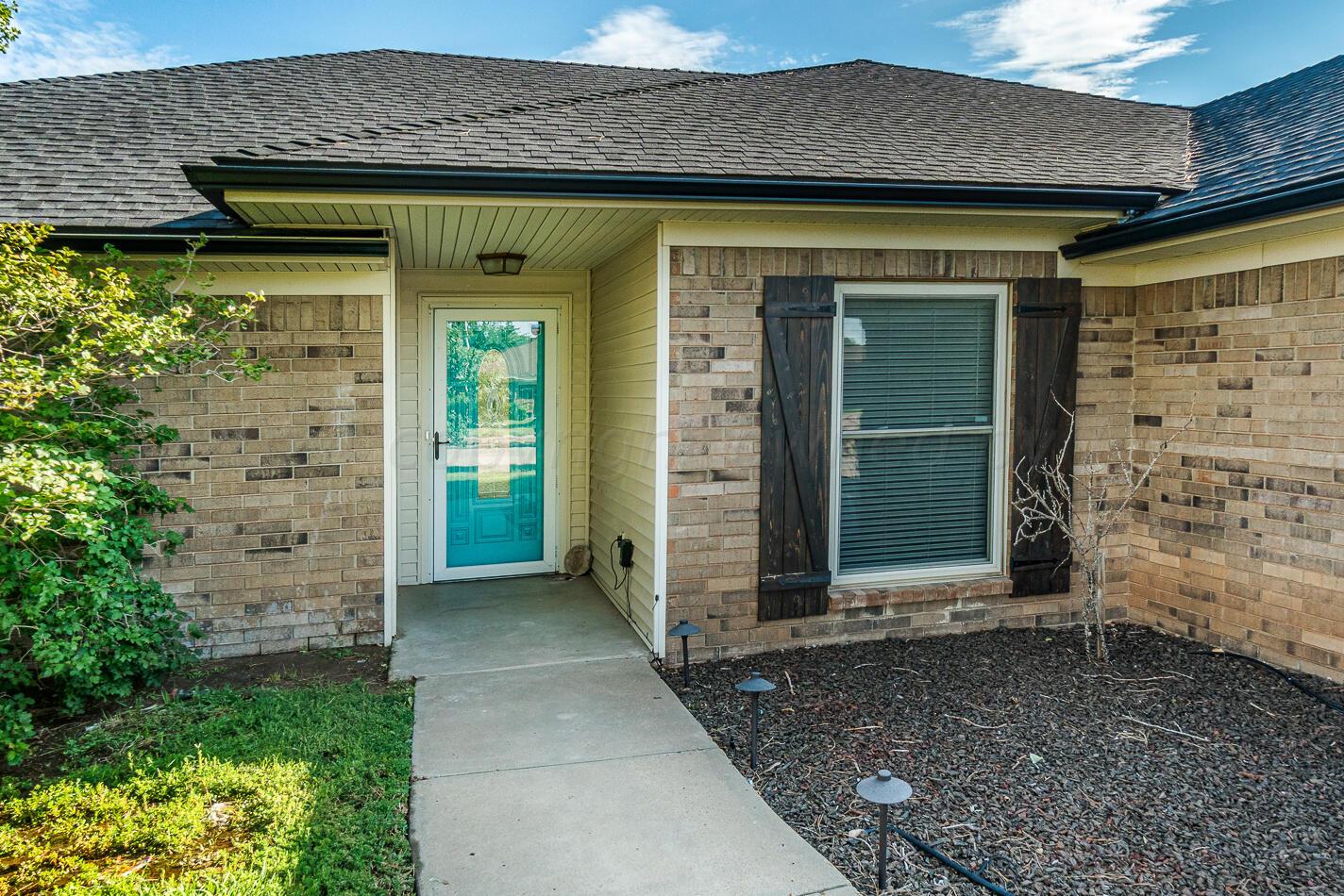8012 Simpson Drive Amarillo, TX 79121 - Photo 3 of 28 a view of a entryway door of the house