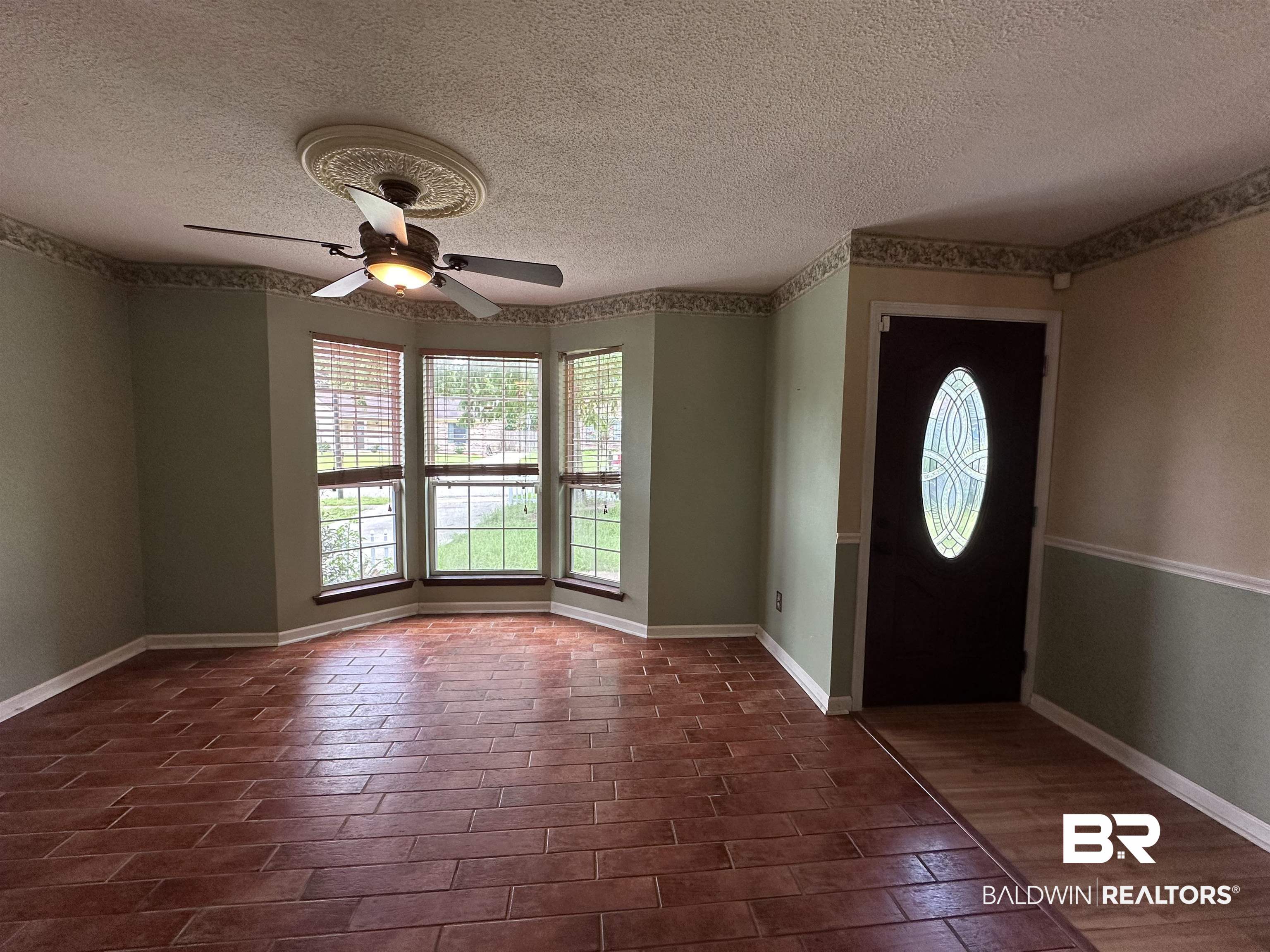 3613 Vista Ridge Drive Mobile, AL 36693 - Photo 2 of 9 Entrance foyer with a textured ceiling and ceiling fan