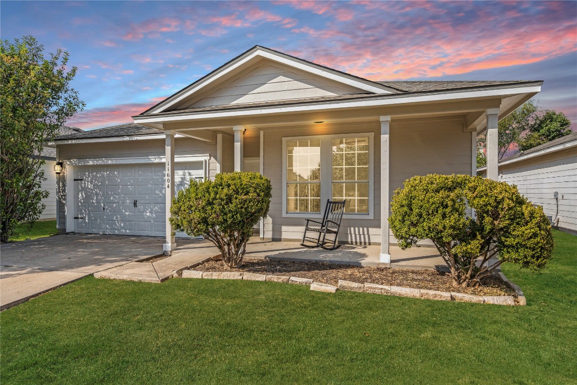 11604 Marshall Street Manor, TX 78653 - Photo 1 of 1 a front view of a house with garden