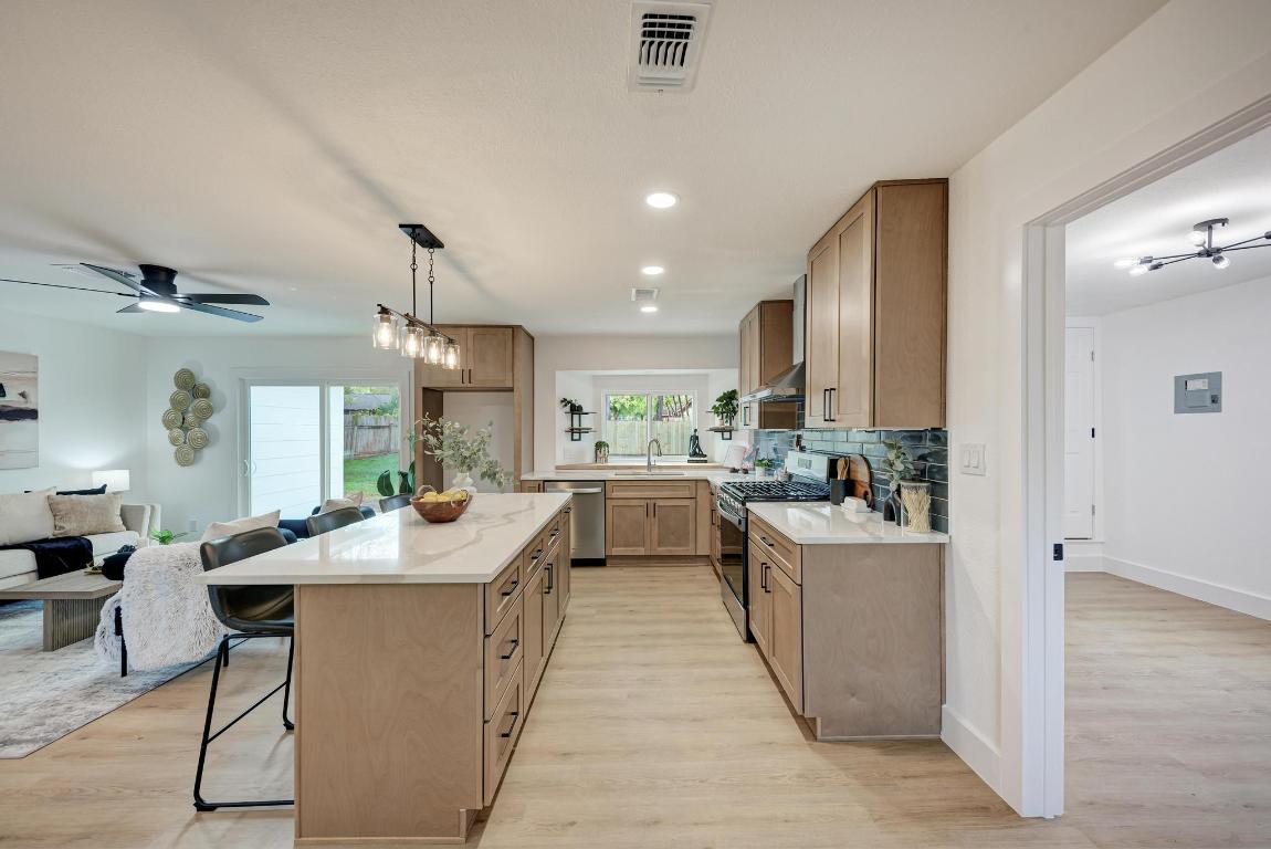 5106 Regency Drive Austin, TX 78724 - Photo 37 of 37 a kitchen with counter top space a sink and appliances
