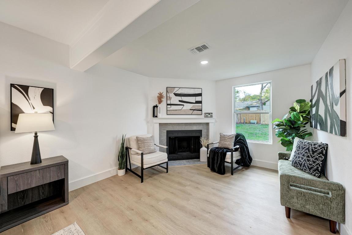 5106 Regency Drive Austin, TX 78724 - Photo 18 of 37 a living room with furniture and a fireplace